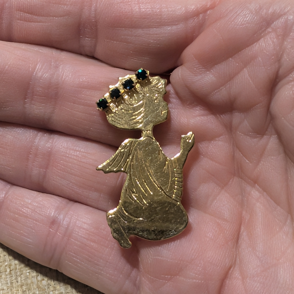 vintage gold-toned kneeling praying angel brooch with green rhinestone accents